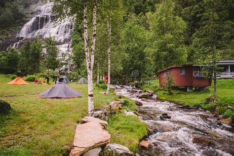 Tvinde Camping Tents on the Background of a Waterfall Tvindefossen in ...