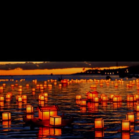 These lights dot the river during the Obon festival in Japan as families release floating ...