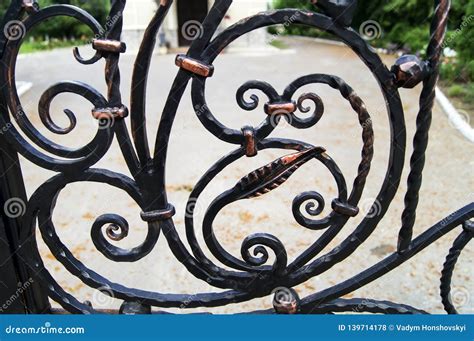 Decorative Elements of Wrought Iron Fencing in Dark Colors Stock Photo - Image of forged ...