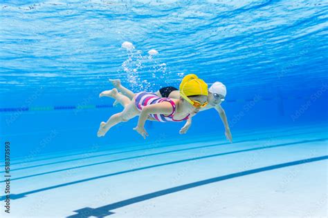 kids swimming underwater Stock Photo | Adobe Stock