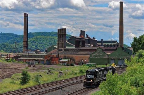 A pair of Norfolk Southern locomotives wait for a green block by the ...