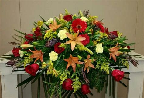 Fall colored casket spray designed at The Lumberton Flower Shop Funeral Floral Arrangements ...