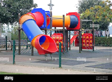 Modern Tunnel Slide Children Theme Playground Park Stock Photo - Alamy