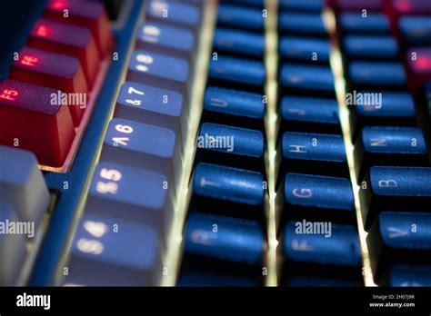 Yellow Backlit Mechanical Keyboard with black, white, red keycaps at an ...