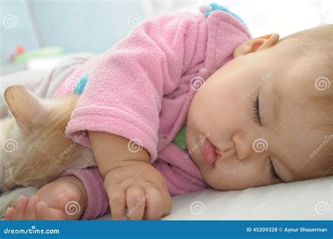 Baby and cat sleeping stock photo. Image of pink, pussycat - 45209328