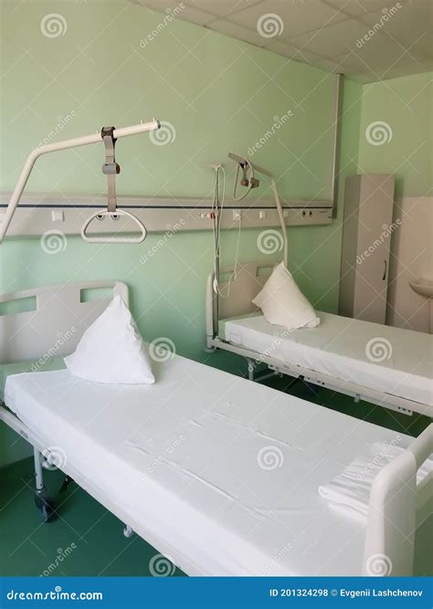 Two Hospital Beds on Wheels in a Hospital Bed Stock Photo - Image of broken, pushing: 201324298