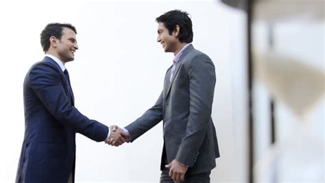 Shot Of Two Businessmen Shaking Their Hands And Talking Stock Footage Video 4330358 - Shutterstock