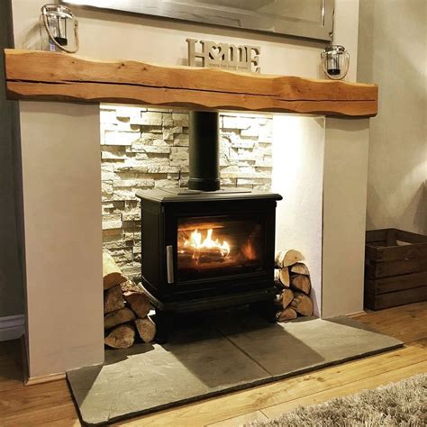 Fireplace backlit woodburner oak mantel | Log burner living room, Winter living room, Living ...