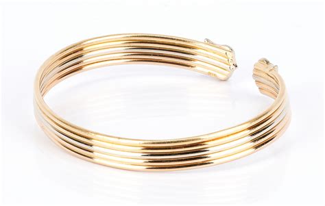 Lot 736: Ladies 18K Gold and Diamond Bangle Bracelet | Case Auctions