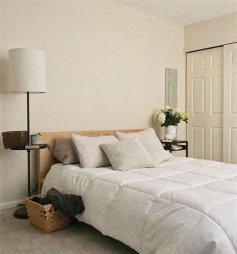 This Zen bedroom has calm whites and natural colors, organic woods and wicker. The room was ...