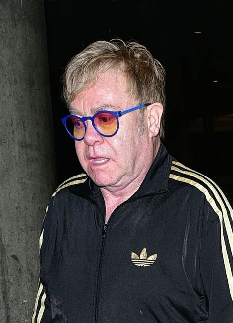 Dlisted | Elton John and David Furnish arrive at LAX