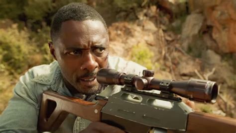 See A Bloodied Idris Elba On The Run From A Ferocious Beast | GIANT ...