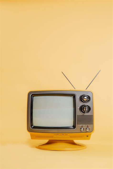 Browse Free HD Images of Yellow TV Set On Monochromatic Seamless Backdrop