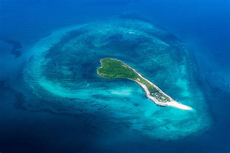 Aerial view of coral islands and surrounding atolls | African Ranger ...