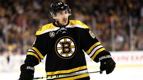 Bruins' Marchand leaves first period after hit, returns to score against Flyers | Sporting News