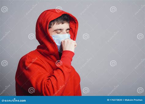 Man in Medical Mask Coughing on Gray Studio Background, Concept of ...