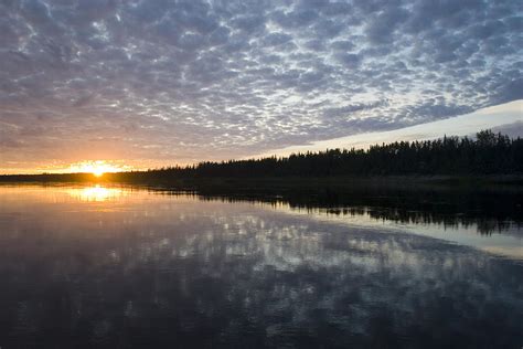 Sunset And Clouds Over Calm Water Photograph by Skip Brown