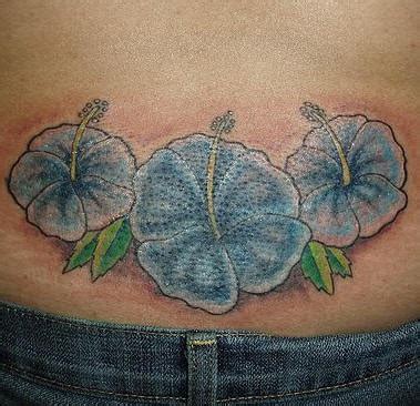 Lower back blue hibiscus tattoo - Tattooimages.biz