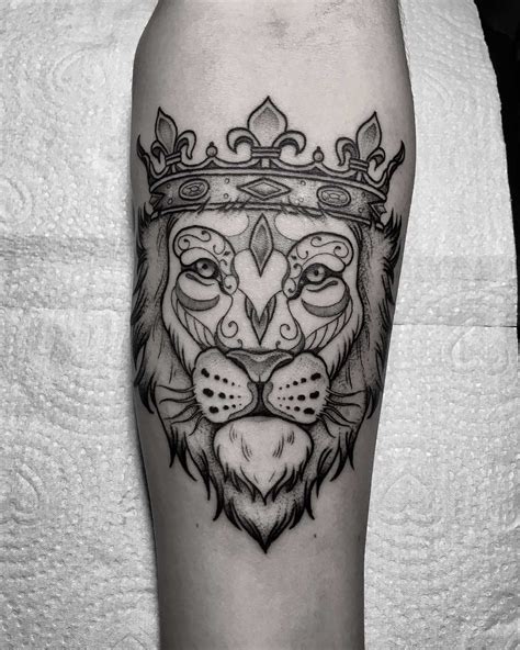 Lion with a crown tattoo - Tattoogrid.net