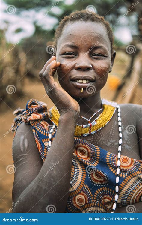 TOPOSA TRIBE, SOUTH SUDAN - MARCH 12, 2020: Young Woman with Traditional Scars of Toposa Tribe ...