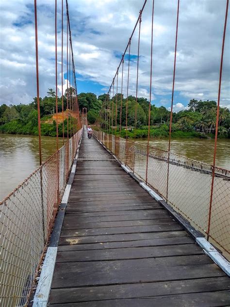 Suspension Bridge that Crossing Mentarang River, Malinau, Outback of Borneo Stock Photo - Image ...