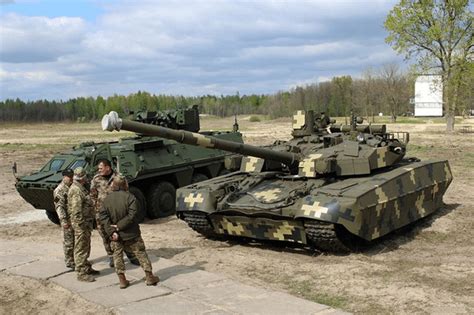 Ukrainian t-84 Oplot in digital camouflage next to a BTR-4 : r/TankPorn