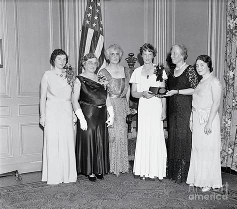 Amelia Earhart Holding Medal by Bettmann