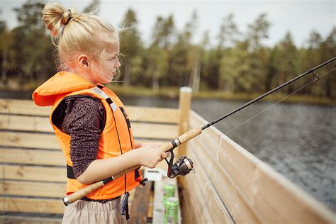 Little Girl Fishing by Flamingo Images - Child, Fishing