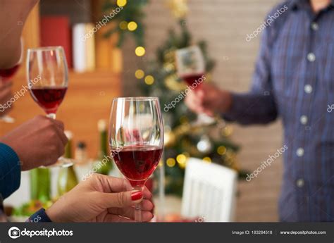 People Drinking Red Wine Chritamas Party Home — Stock Photo © DragonImages #183284518