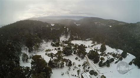 The foothills of Mt Wellington / kunanyi, covered in snow. | Aerial, Natural landmarks, Outdoor