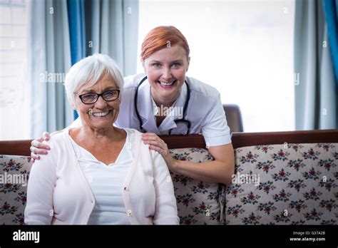 Portrait of smiling doctor and patient Stock Photo - Alamy