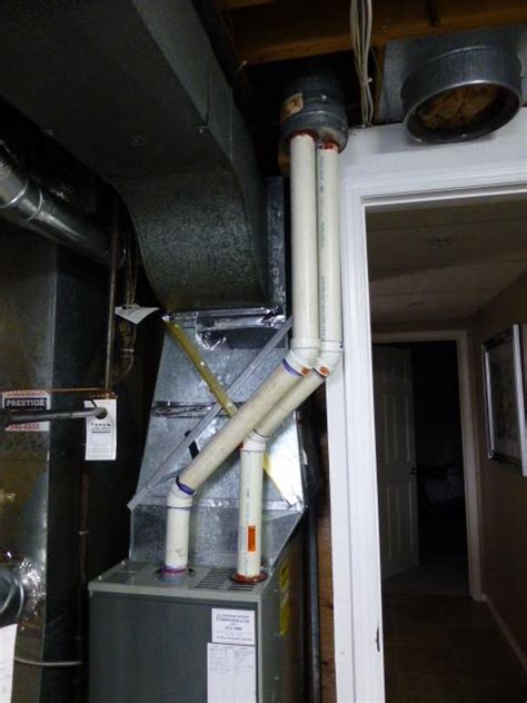 Furnace vent pipe on roof full of frost, fan won't push hot air - Home Improvement Stack Exchange