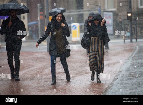 People walking through heavy rain in Birmingham city centre. The Met ...