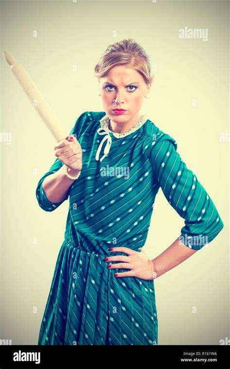 Angry old woman rolling pin hi-res stock photography and images - Alamy
