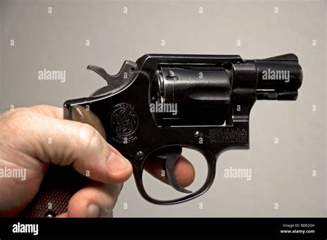 Finger on the trigger of a Smith and Wesson 38 caliber snub nose revolver Stock Photo - Alamy