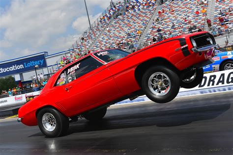 It’s Friday. Time to look at musclecars doing wheelies.