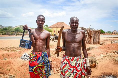 Two Angolans in traditional dress. | Angola, Traditional dresses, African