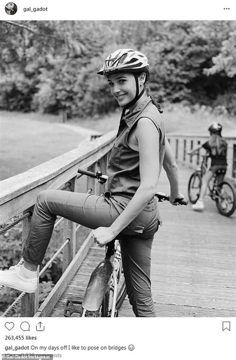 Gal Gadot smiles in a selfie on a bike over a bridge: 'On my days off I like to pose on bridges ...