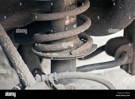 Broken rear offside car suspension spring part of a Volvo V40 Stock Photo - Alamy