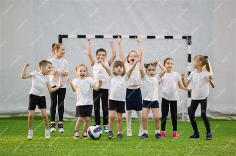 Premium Photo | Little kids playing football indoors happy children ...