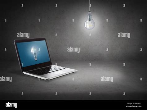 laptop computer with light bulb on screen Stock Photo - Alamy