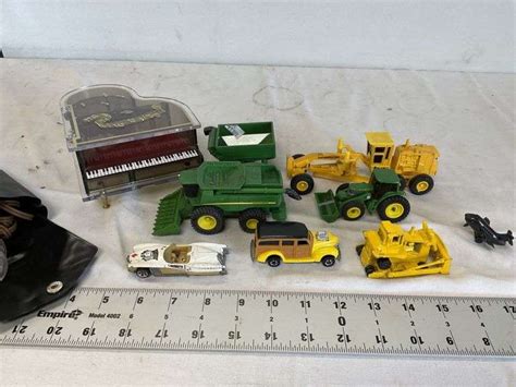 Tractors, music box, etc - Legacy Auction Company