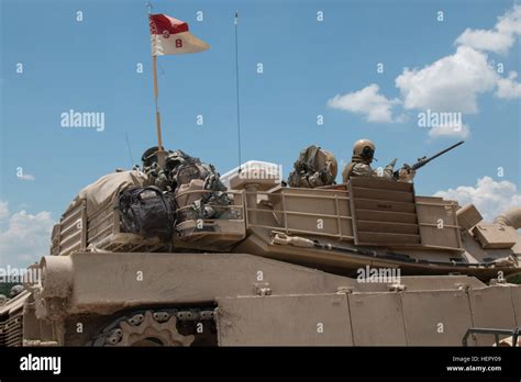 An M1A2 Abrams tank crew from Company B, 3rd Battalion, 8th Cavalry ...