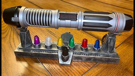 Galaxy’s Edge Savi’s Lightsaber and Kyber Crystal Display Stand. From SymplieB Designs - YouTube