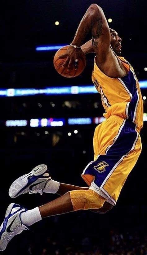 Download "Kobe Bryant showing off his impressive dunking abilities" Wallpaper | Wallpapers.com