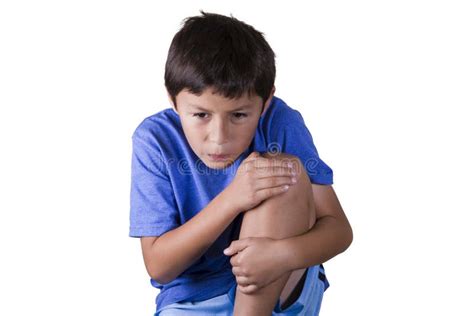 Young boy with sore knee stock photo. Image of male, face - 37036700