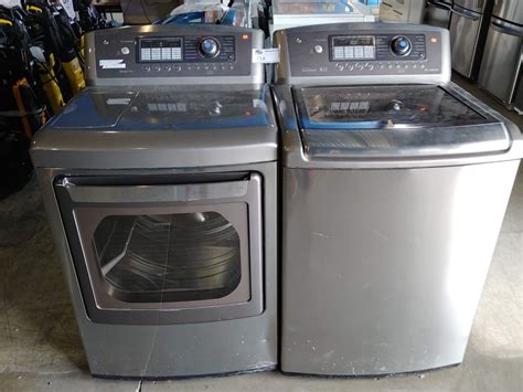 GREY LG WAVEFORCE WASHER AND TRUE STEAM DRYER SET - Able Auctions