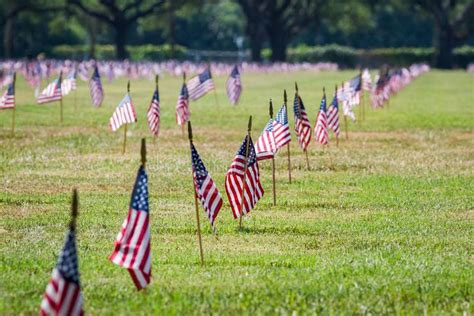 Us flags in a veterans cemetery on Veterans day. Rows of flags on each grave of , #Aff, # ...