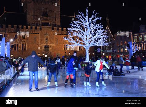 Panned camera effect on People skating on the Christmas Ice rink ...