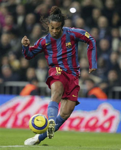 Ronaldinho of Barcelona scores a goal against Real Madrid during a Primera Liga match between ...